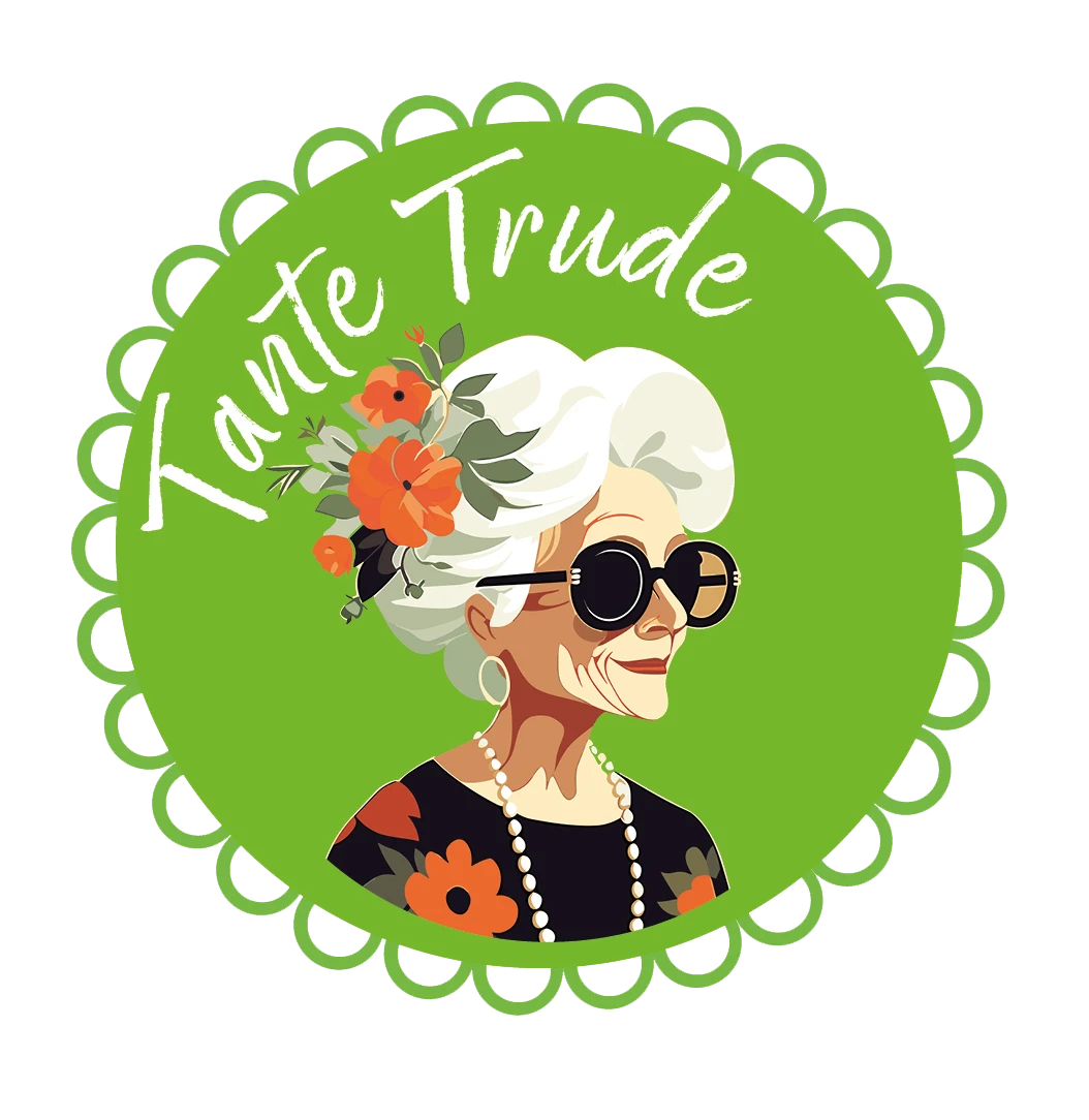 Tante Trude Logo Logo mit einer lächelnden alten Frau, die Sonnenbrille und Blumen im Haar trägt. Daneben steht Tante Trude.